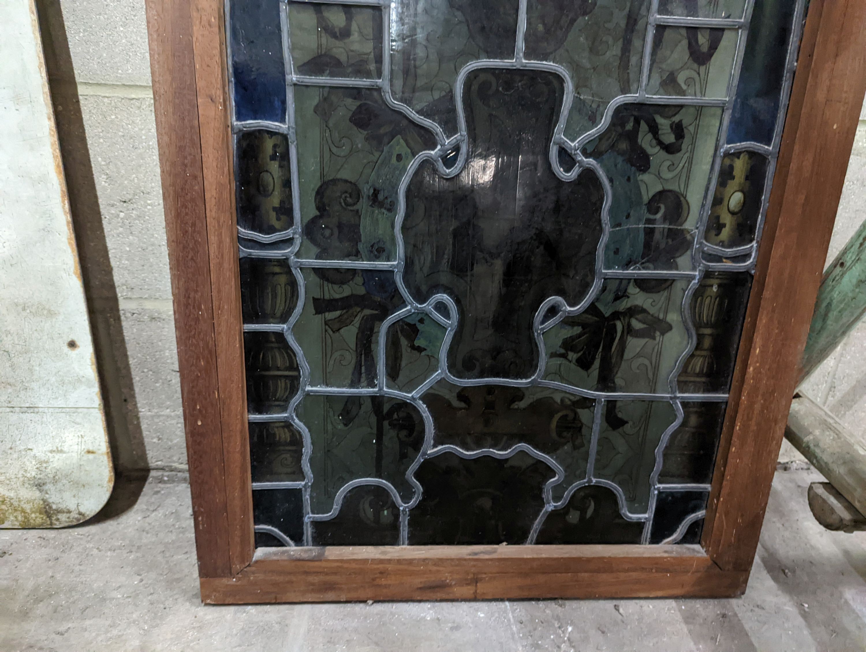 A rectangular stained glass panel, width 56cm, height 99cm including frame